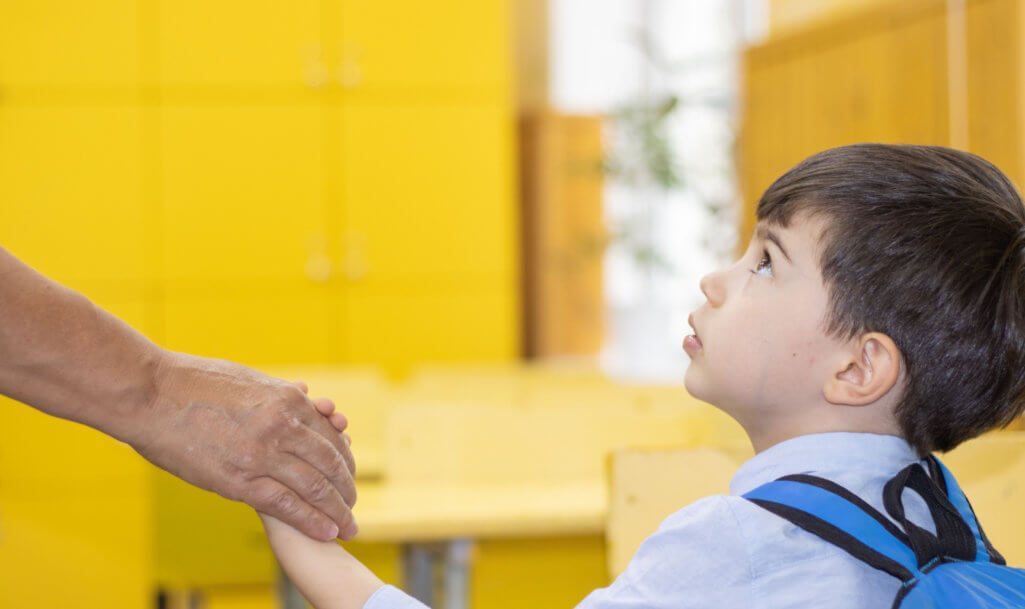 first day at school preschool kid holding mother hand